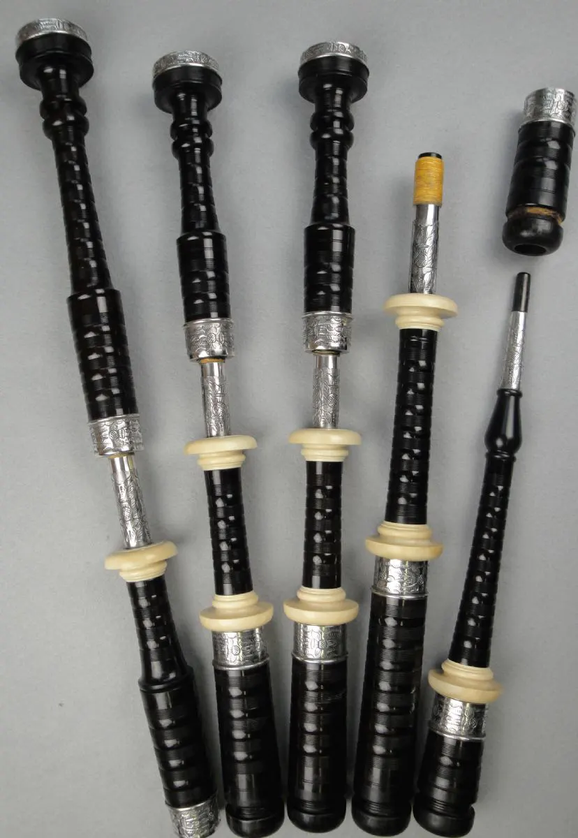 Dunbars, Circa 1970, Engraved Silver with Holly Projecting Mounts