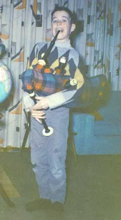 jim playing bagpipes as a kid